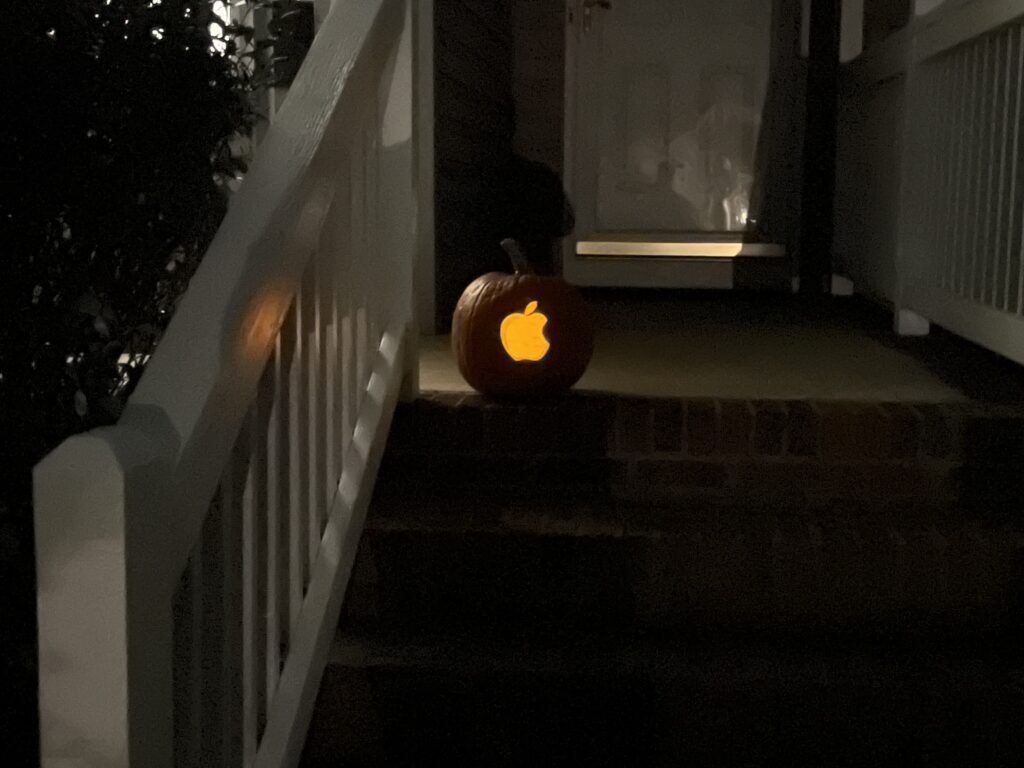 A pumpkin with the Apple logo carved in it. 